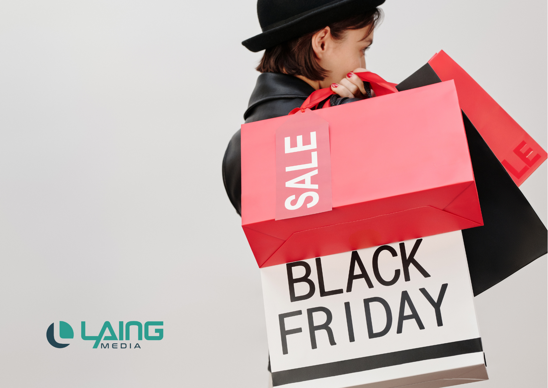 Woman Black Friday Shopping with Laing Media logo